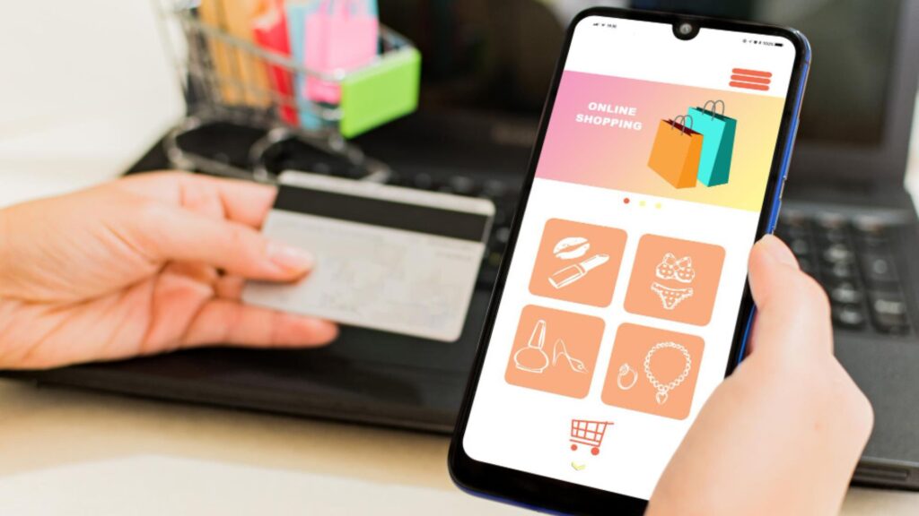 Person using phone and credit card