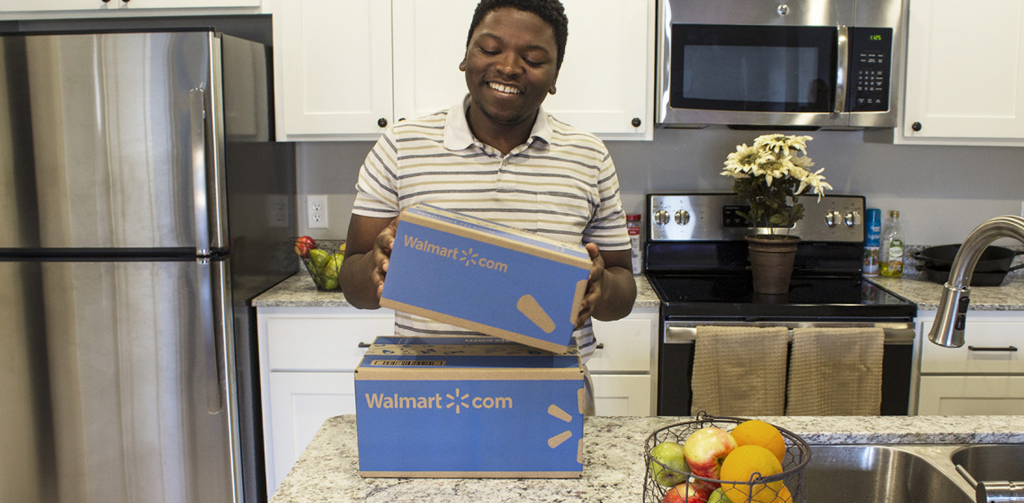 man opening package from walmart.com
