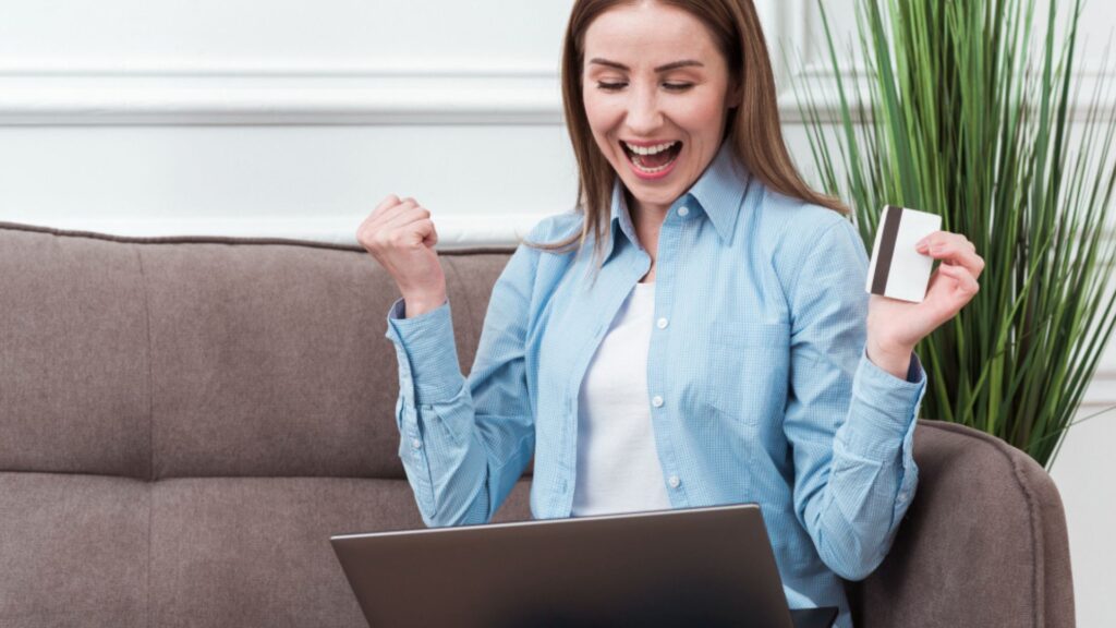 Woman sitting on couch shopping online