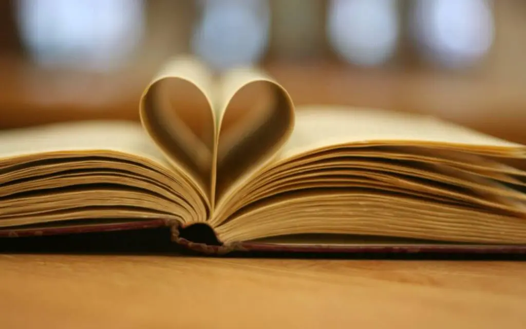 celebrate national reading month book with heart in pages