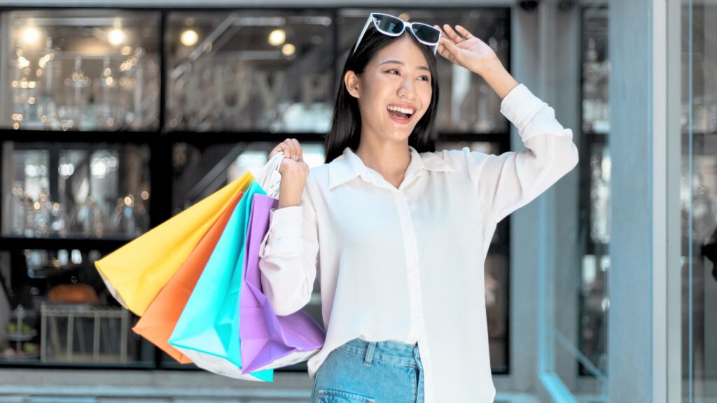 Woman smiling with shopping bags