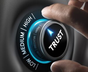 Hand dialing up a trust meter to high