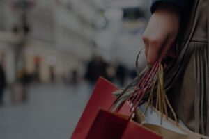 Woman with shopping bags darkened image