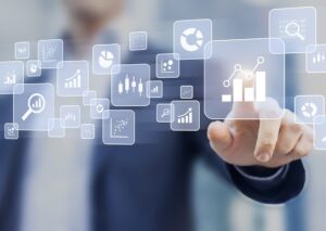 Graphics floating with man pressing analytics