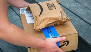 Person grabbing Amazon packages