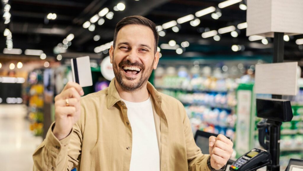 man getting cash back through receipts