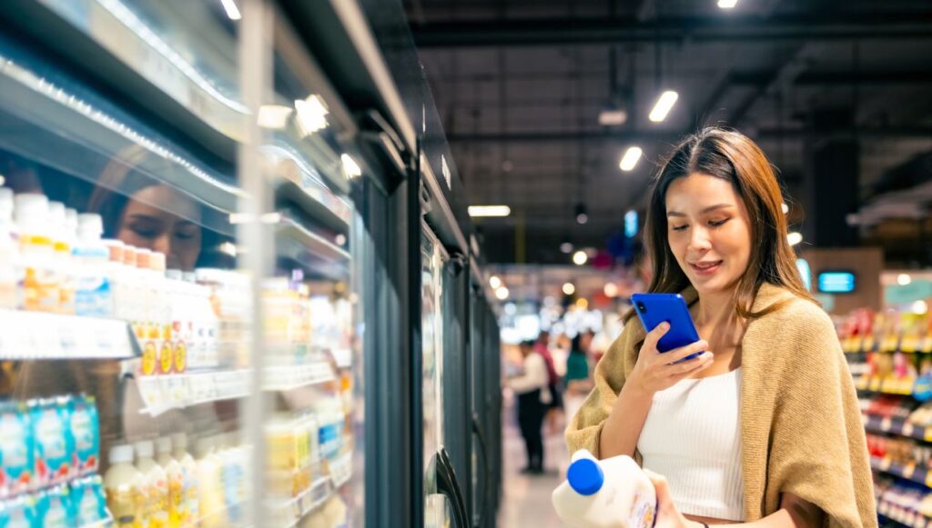 woman looking at milk to scan