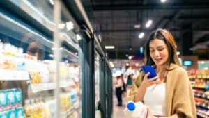 woman looking at milk to scan