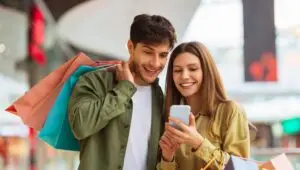 Couple shopping at mall with bags