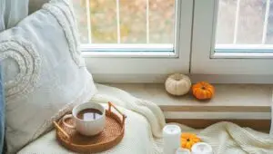 Cozy home fall decor with coffee and pumpkins