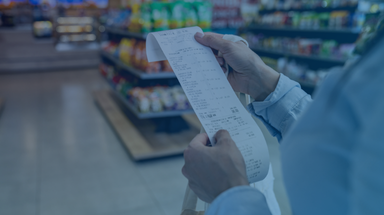 Woman shopping at a store and checking her receipt